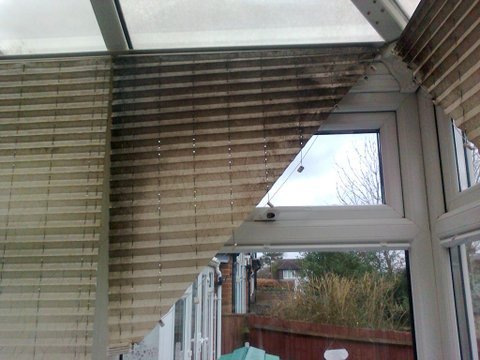 Dusty striped venetian blinds before ultrasonic cleaning